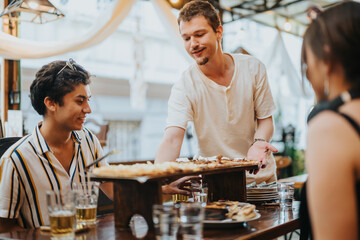 Poster - A group of young friends having a pleasant time sharing pizza at an outdoor restaurant. The atmosphere is relaxed and sociable as they enjoy casual dining together.