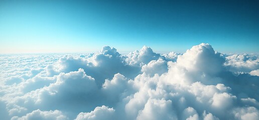 Wall Mural - Aerial view of fluffy white cloudscape under a bright blue sky.