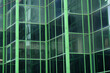 © Towfiqu Barbhuiya  - A Modern Green Glass Building Facade Featuring Striking and Intricate Geometric Patterns
