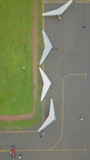Title: Aerial View of Hang Gliders on a Field