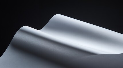 Wall Mural - abstract art: soft curves of white paper against a dark background.