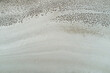 © Austockphoto - Surface texture and patterns of a dry salt lake