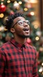 © BlackBird Studio - Joyful Man Celebrating the Holiday Season Under a Christmas Tree