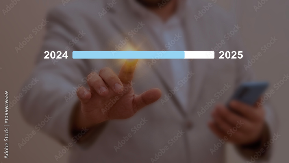 Businessman pointing at a progress bar transitioning from 2024 to 2025 ...