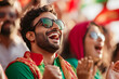 © PRASANNAPIX - Bangladeshi cricket fans in a stadium gallery, celebrating a victory in the warm afternoon light.