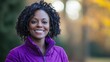 © VRVisionary - A woman wearing a purple jacket smiles toward the camera