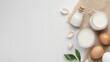 © Worakit - Fresh milk, eggs, and cream arranged on neutral background create bright and eye catching composition. natural elements evoke sense of simplicity and freshness