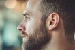 © Feri - A Close-Up Profile of a Man with a Beard, Contemplative Gaze,  Thoughtful Expression, and Short Brown Hair