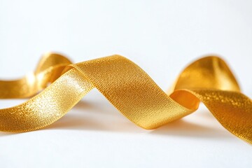 Poster - A close-up shot of a shiny gold ribbon lying flat on a white surface