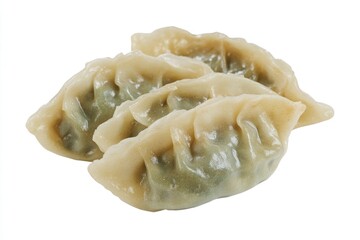 Poster - A close-up view of two dumplings on a white surface, perfect for food photography or illustration