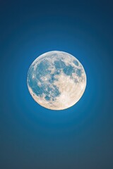 Aufkleber - A picture of a full moon shining brightly in a clear blue sky with a small plane flying in the foreground