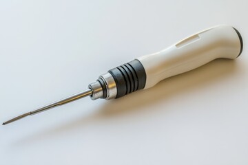 Poster - A close-up view of a screwdriver lying on a table, perfect for use in DIY or repair contexts