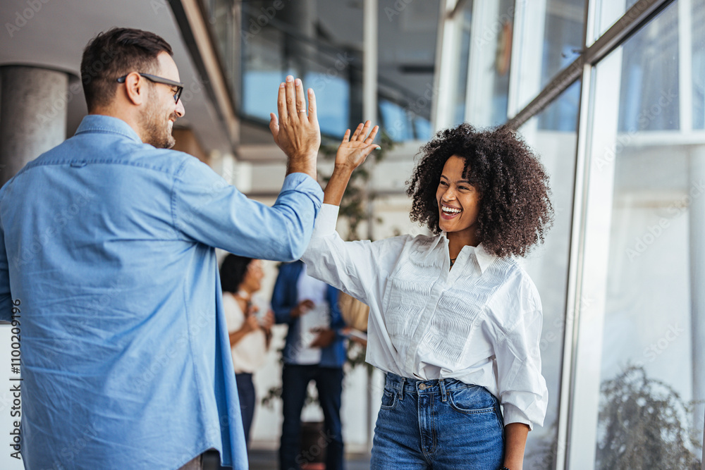Colleagues Celebrating Success With a High Five in the Office Stock ...