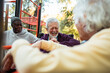 © Marko Geber - Senior male friends working out at outdoor exercise park