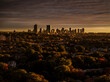 © AmazingAerialAgency - Aerial view of boston skyline under dramatic stormy skies with beautiful trees and buildings, jamaica plain, united states.