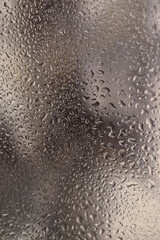 Wall Mural - Soft focus  through glass with wet water drops. Abstract nature blur background.