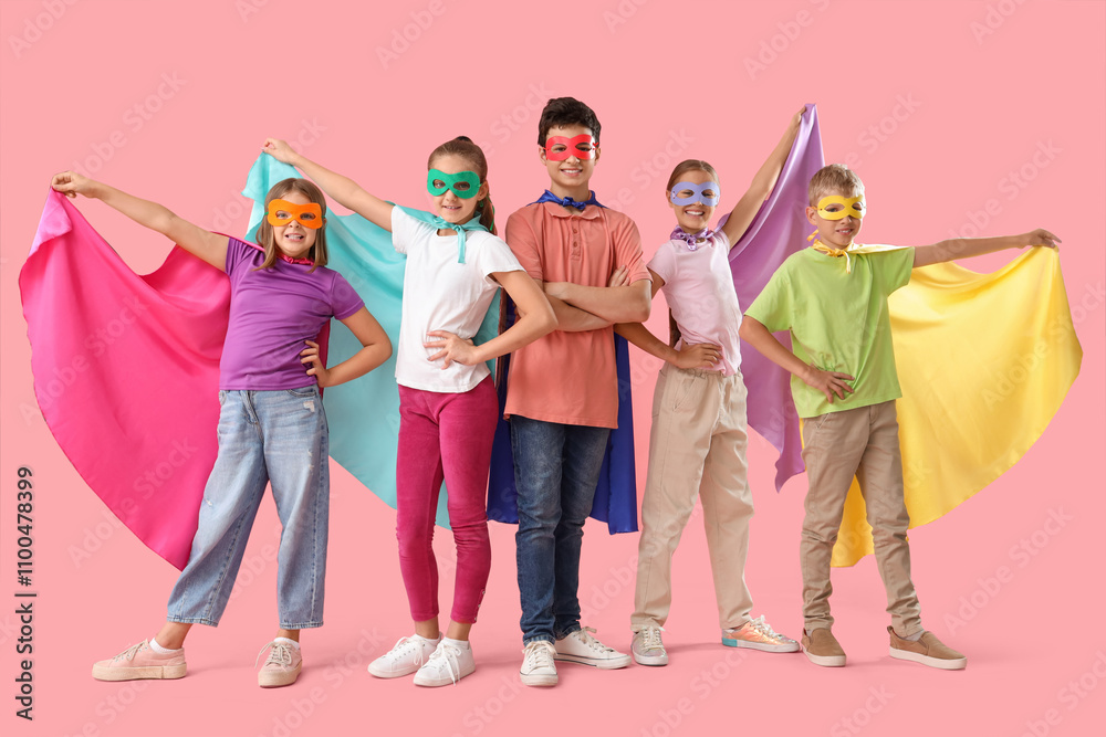 Pupils dressed as superheroes on pink background