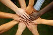 © Nognapas - International business team showing unity with their hands together