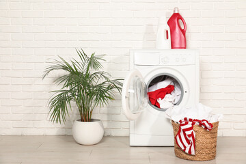 Wall Mural - Washing machine, detergents and basket with laundry in room