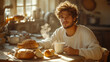 © sommersby - A young man enjoys a warm cup of coffee and fresh bread in a rustic kitchen filled with morning light. It’s a peaceful start to the day