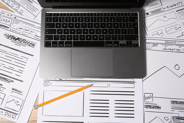 Leinwandbilder - Website development. Sketches of wireframes, laptop and pencil on wooden table, flat lay