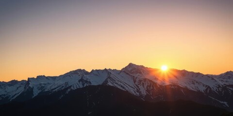 Wall Mural - a breathtaking view of the sun setting behind snow-capped mountains, casting a warm glow over the ru