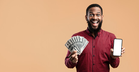 Poster - Making Money On Internet. Excited black guy showing cell phone with blank screen and bunch of money, yellow wall