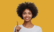 © Deja - Africa Young woman over isolated background pointing to the side to present  product