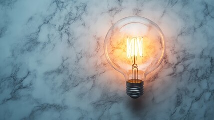 Poster - Vintage Edison Light Bulb Glowing on Marble Background, Creating an Aesthetic Ambiance for Modern Interior Decor and Creative Photography Projects
