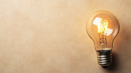 Poster - Vintage Light Bulb on Plain Background Illuminating Warm Glow, Symbolizing Creativity, Inspiration, and Innovative Ideas in a Nostalgic Atmosphere