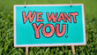 © HQAsset - Hand-drawn teal sign in grass proclaims 'We Want You!'
