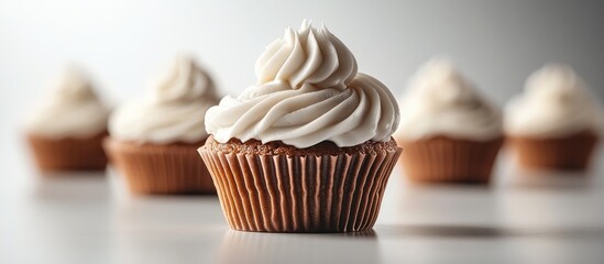 Aufkleber - Delicious cupcakes adorned with creamy frosting on a minimalist white background, showcasing a tempting dessert display for culinary delights.