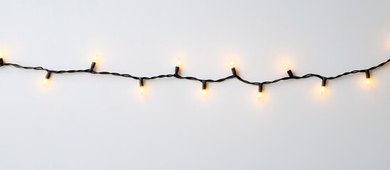 Aufkleber - Christmas lights on a white background showcasing a string of warm glowing lights for holiday decorations and festive themes.