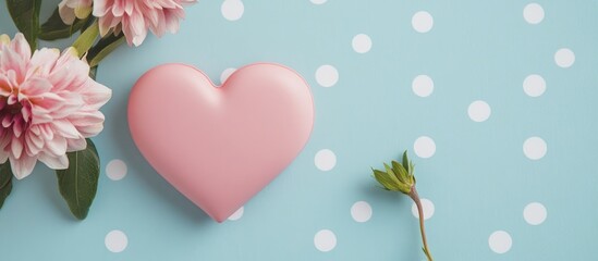 Poster - Valentine's Day concept with a pink heart on a blue polka dot background complemented by a stunning flower arrangement.
