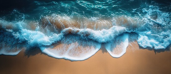 Aufkleber - Gentle ocean waves cascading onto a serene sandy beach creating a tranquil coastal scene