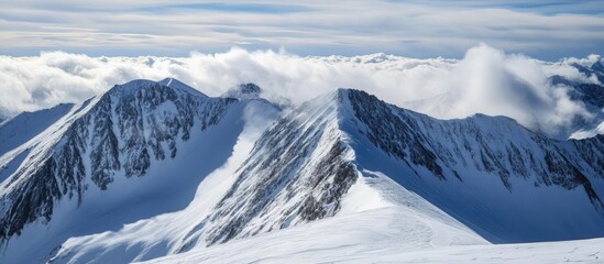 Poster - Stunning Winter Mountain Landscape with Snow-Capped Peaks and Clouds at Summit View