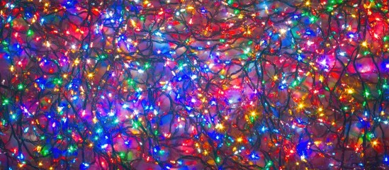 Poster - Colorful abstract background of Christmas lights twinkling in vibrant patterns creating a festive and cheerful mood