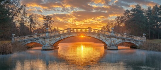 Poster - Tranquil sunset view of ornate bridges crossing a serene river with reflections amidst lush greenery and vibrant clouds in the sky.