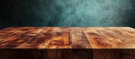 Poster - Empty wooden kitchen table with textured surface ready for festive celebrations and gatherings against a blurred atmospheric background.