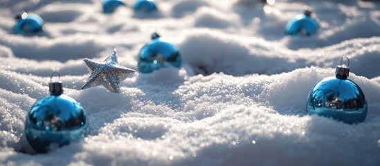Aufkleber - Blue Christmas baubles and silver star ornaments scattered on a snow-covered ground creating a festive winter scene.