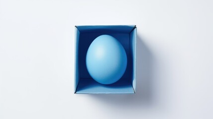 Aufkleber - Blue Easter egg nestled in a blue carton on a clean white background with ample copy space for festive holiday designs and promotions