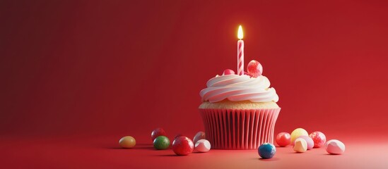 Aufkleber - Colorful birthday cupcake with a lit candle surrounded by candy on a vibrant red background ideal for festive celebrations and decorations.