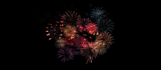 Poster - Vibrant fireworks display in multiple colors lighting up the night sky during festive celebrations and holiday events