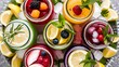 © Kartik - Top view of detox drinks in jars near fruit slices, berries, mint and rosemary