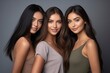 © FoxTok - Girls of different races smile on plain gray background. Models of different religions and cultures, natural beauty of women, friendship of different countries and peoples