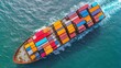 © Atchariya63 - Aerial view of a vibrant cargo ship navigating through blue ocean waters.