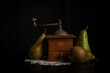 © Cavan Images - View of pears with mill, black background