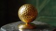 © ebosBond - Elegant Gold Golf Ball on Display Pedestal