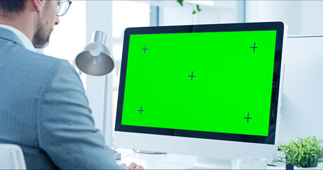 Poster - Green screen, computer and businessman in office with research for stock market. Technology, tracking markers and financial advisor on desktop for capital gain, profit or revenue investment report.