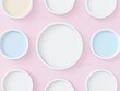 © Vadym - Top view of multiple white cylinder frames on pastel pink background. Empty frames ready for mockups. Abstract design. Minimalist style. Suitable for cosmetic product display. Creative presentation.